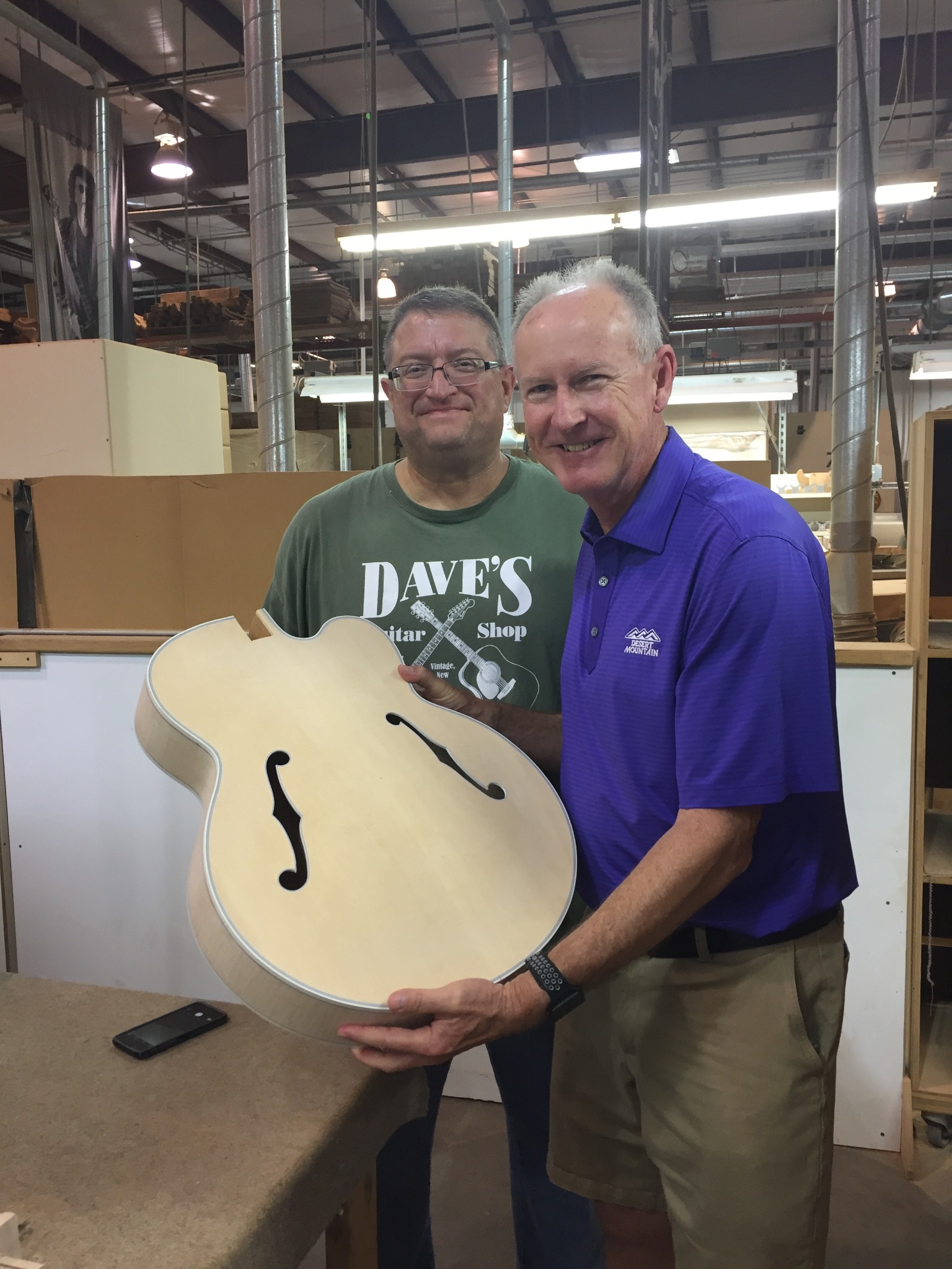 Gary Thomas with an unfinished archtop body at the Gibson factory