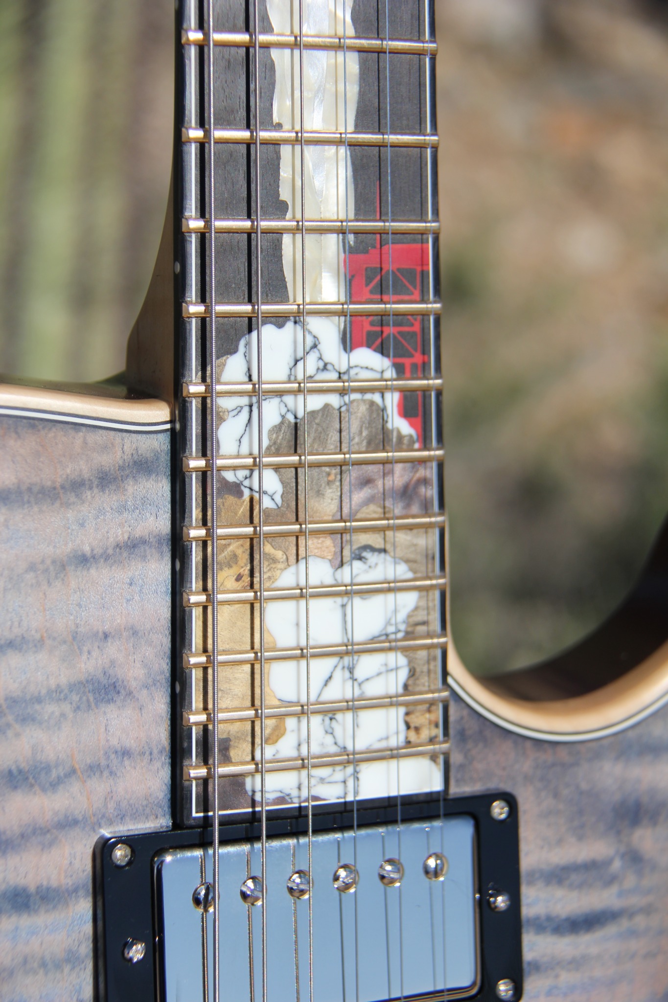Apollo fingerboard inlay