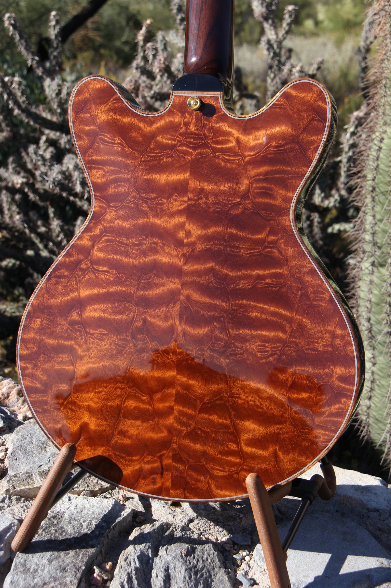 Carved quilted-mahogany back from “The Tree”